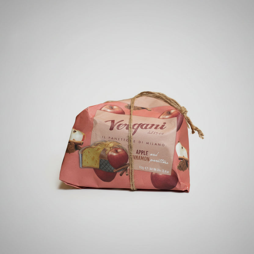 Packaged bread with apples and cinnamon on a pink background, branded 'Vergani'.