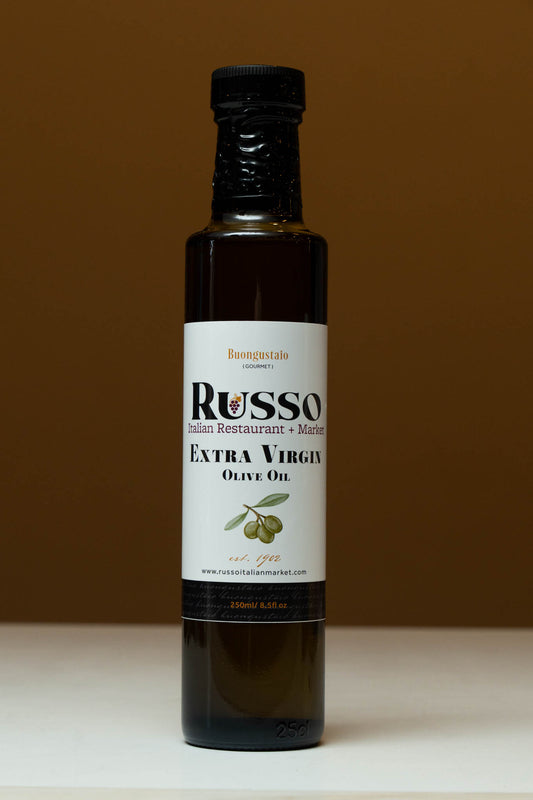 Bottle of Russo Extra Virgin Olive Oil on a brown background