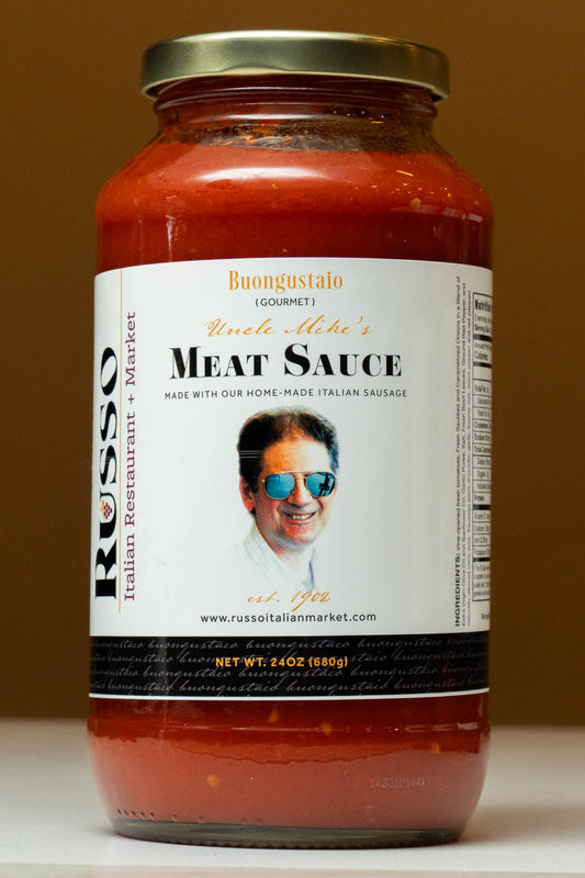 Jar of Russo Meat Sauce with a label featuring a man's face on a brown background