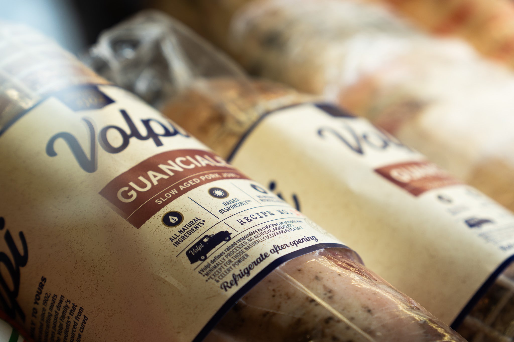 Close-up of Volpi Guanciale packaging with a blurred background